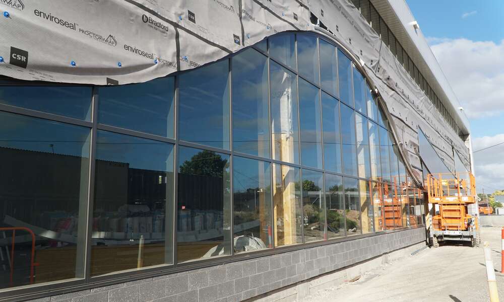 The installation of windows is transforming the look and feel of the Wulanda Recreation and Convention Centre as the facility nears lock up stage.