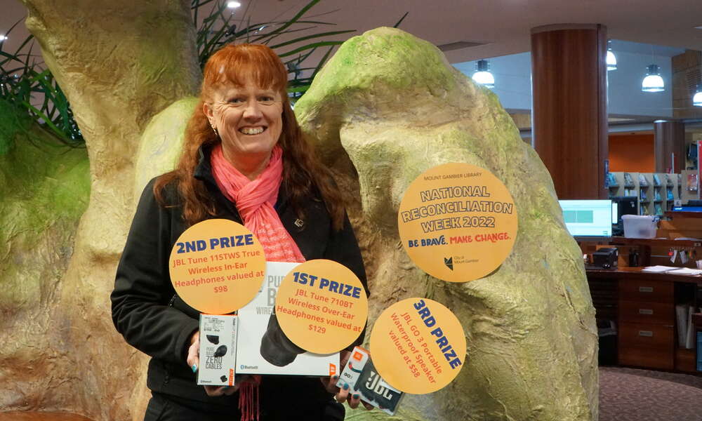 City of Mount Gambier Manager Library and Community Development Georgina Davison with the 'Boandik Country; Through My Lens Photography Challenge' prizes up for grabs as part of the National Reconciliation Week program.