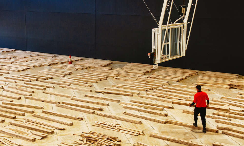 Installation of the maple flooring in the Western Bank of courts at the Wulanda Recreation and Convention Centre in August 2022.