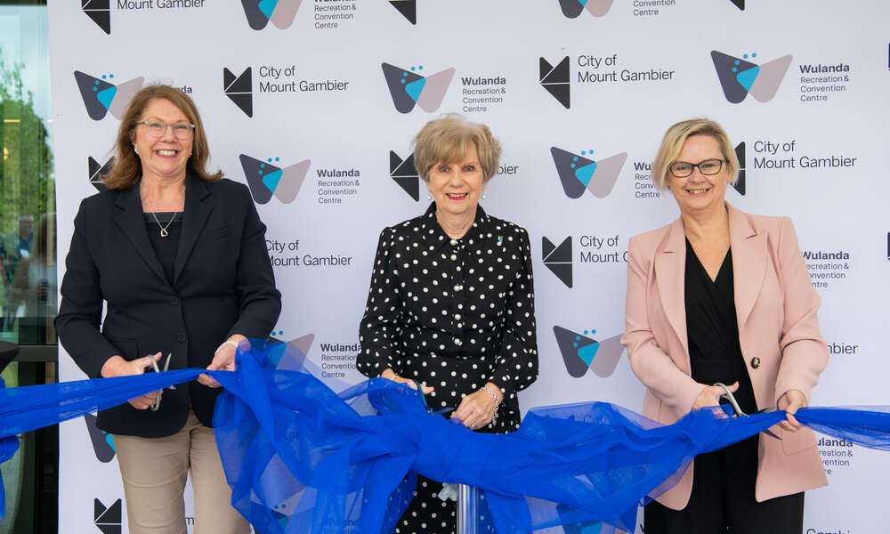 (L-R) Federal Minister for Infrastructure, Transport, Regional Development and Local Government Catherine King MP, Mayor of Mount Gambier Lynette Martin OAM and Minister for Primary Industries, Regional Development, Forest Industries, Clare Scriven MP cut the ribbon on 16 March 2023 at the official opening of the Wulanda Recreation and Convention Centre in Mount Gambier, South Australia. (Photo by Georgia Page/City of Mount Gambier)
