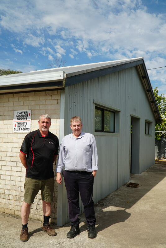 Apollo Football Club President Jerome England (right) and Vice President Andrew Donohue pictured with the existing men’s changerooms set to be demolished and replaced with four brand new change facilities.