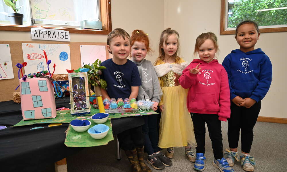 Akuna Kindergarten students Billy, Willow, Annabelle, Hazel and Sierra with a 3D model creation of their ideas for the Railway Lands play precinct.