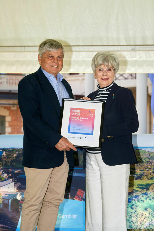 Mayor Martin presents the 2024 Senior Citizen of the Year Award to Kevin Douglas. The community is encouraged to consider worthy nominees for the 2025 Citizen of the Year Awards.