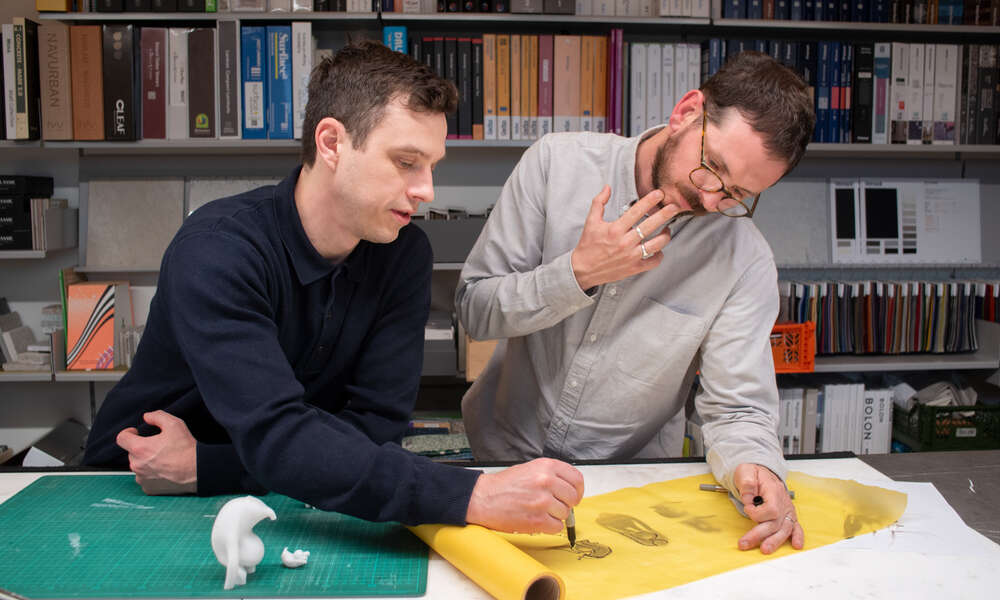 Artists Mitch Walker and Tom Proctor of Huna design studio in Melbourne fine tune their concept for a piece of art that is representative of many kinds of ancient marsupials found in the region.