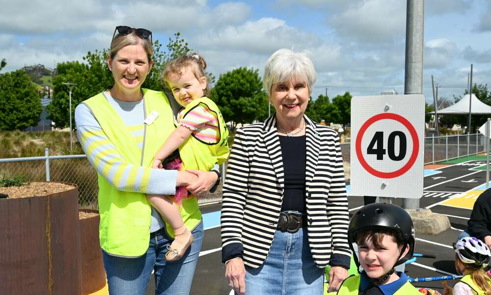 Kate, Raven and Ollie with Mayor Martin at the learn to ride mini streetscape.