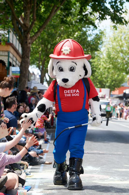 The community is reminded to stay behind the blue line during the parade.