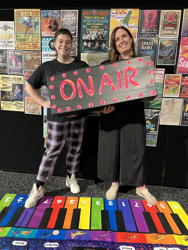 Riddoch Exhibition and Event Support Officer Kyra Sykes (left) and Programming Assistant Bianca Richardson invite you to step into The Green Room, a new interactive creative space inspired by the current exhibition, Enjoy this Trip: The Art of Music Posters.