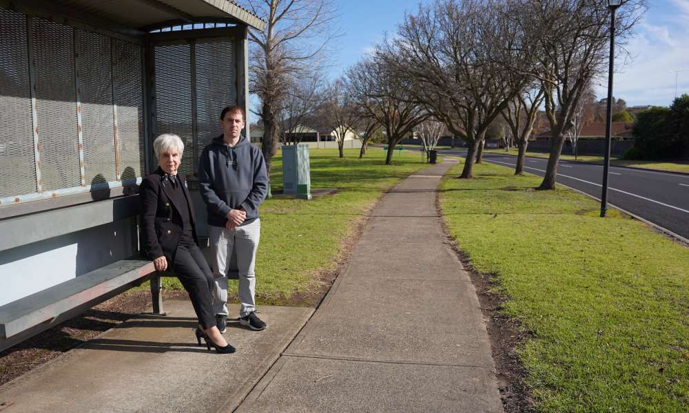 WAITING: City of Mount Gambier Mayor Lynette Martin and deputy Mayor Cr Josh Lynagh at the Don McDonnell Reserve bus stop in Conroe Heights, an urban development undertaken in the 1980s. Despite 2,000 homes and 5,000 residents living in the area, the bus only stops here for the school run.