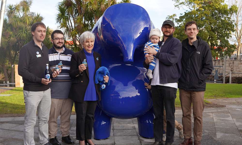 Councillor Josh Lynagh, Councillor Jason Virgo, Mayor Lynette Martin and Huna Studio artists Tom Proctor and baby Frankie and Mitch Walker.