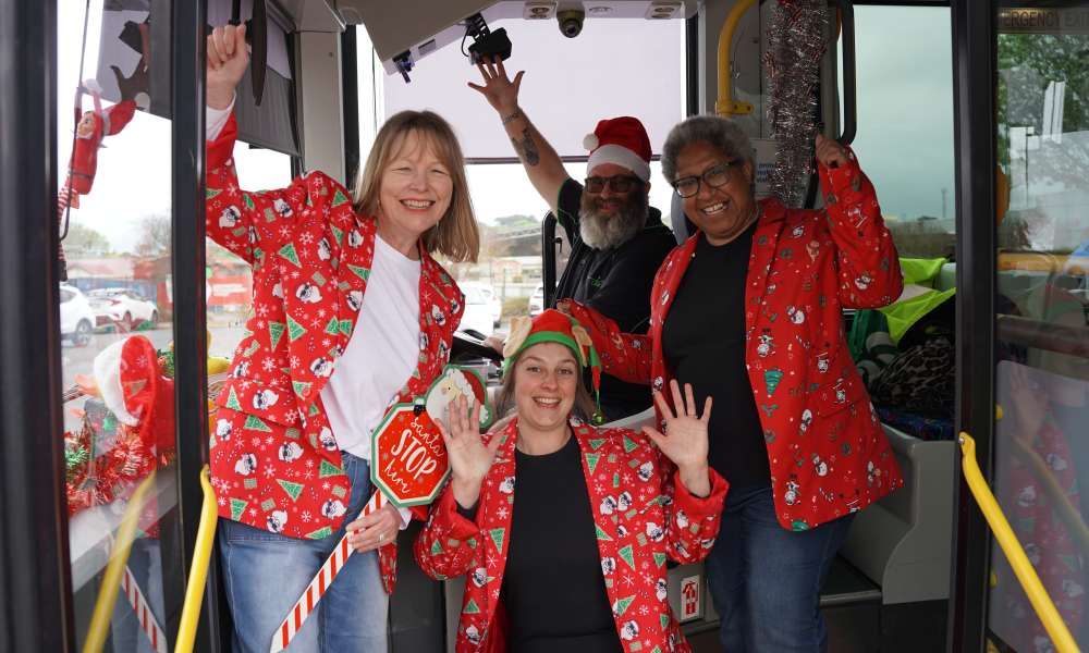 All aboard the Christmas Parade bus: Keolis Downer LinkSA Leading Hand Mount Gambier Stephen Lucas (back), City of Mount Gambier Events Team Leader Xarnia Keding (left) and Community Events Officers Liana Golubic and Kristine Berry.