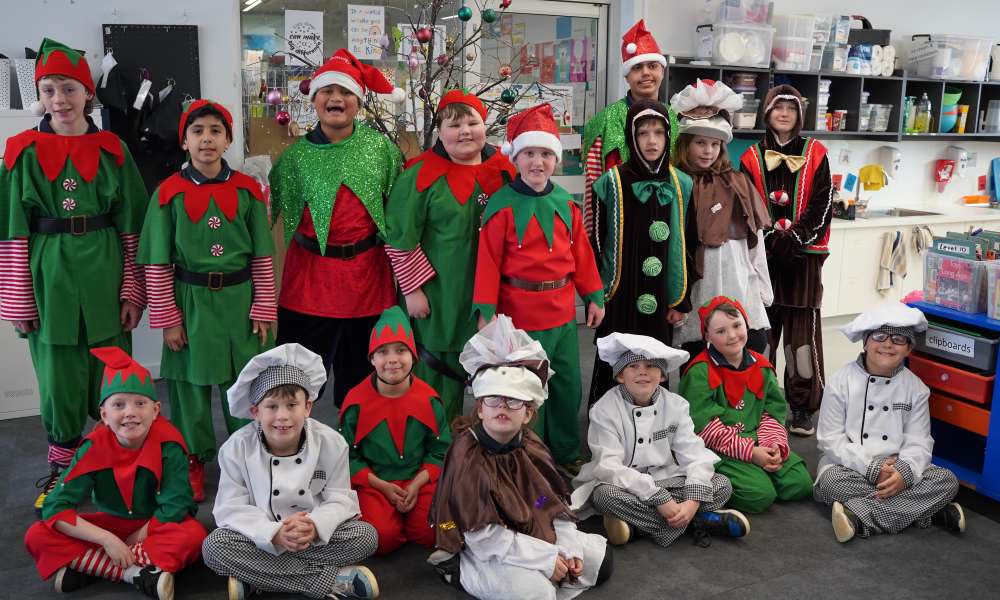 North Gambier Primary School students try on their festive costumes in readiness for the parade.