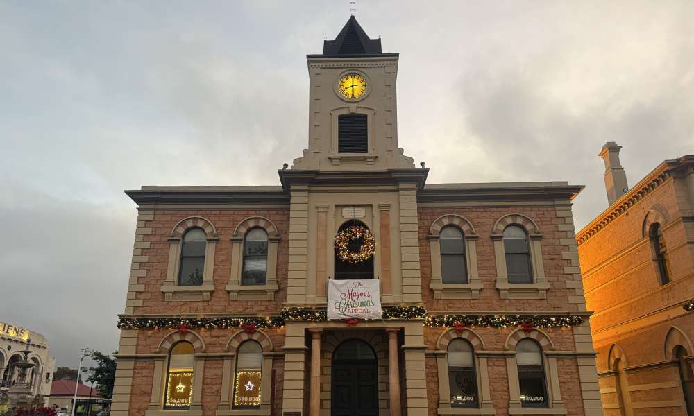 Two windows are lit up at the Old Town Hall, as the Mount Gambier Community Mayor’s Christmas Appeal surpasses $10,000 in donations.