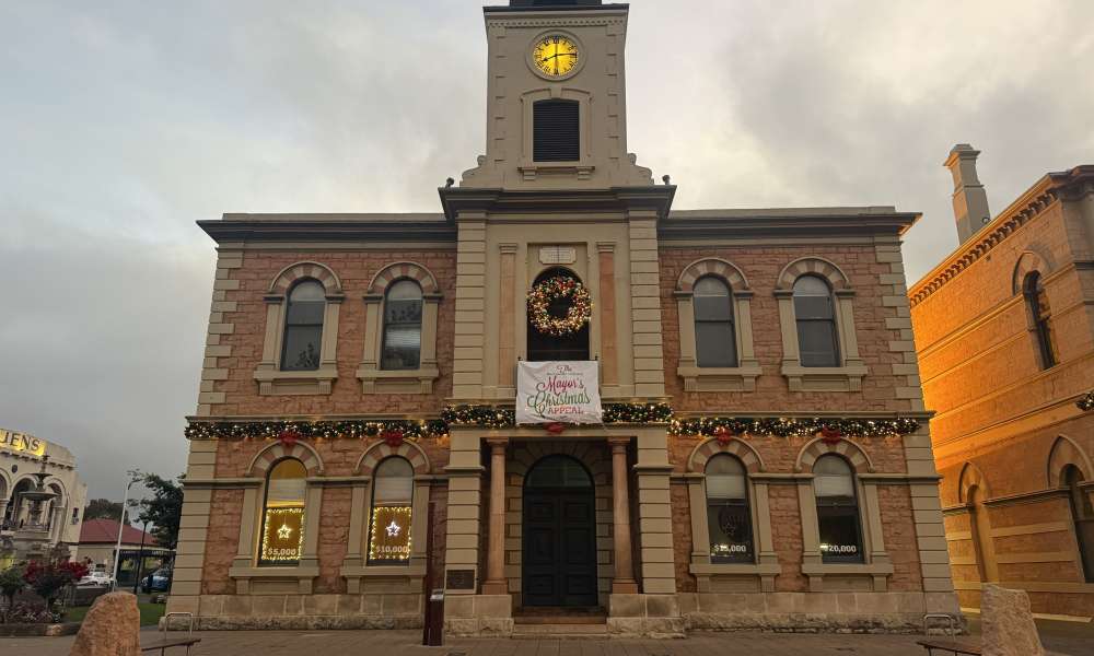 Two windows are lit up at the Old Town Hall, as the Mount Gambier Community Mayor’s Christmas Appeal surpasses $10,000 in donations.