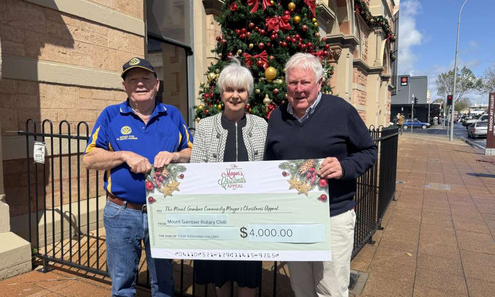 Rotary Club of Mount Gambier President Maurie Watson and Secretary John Sullivan presented Mayor Martin with a $4,000 donation raised from barbecue sales at the ReUse Market.