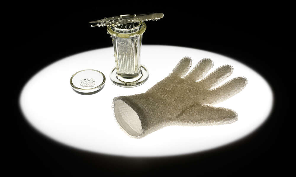 ‘In Preparation for Seeing: Cell Culture Glove’ - white cotton glove encrusted with glass spheres, Coplin jar, microscope slides, steel forceps inlaid with glass spheres, light pad, image: Grant Hancock