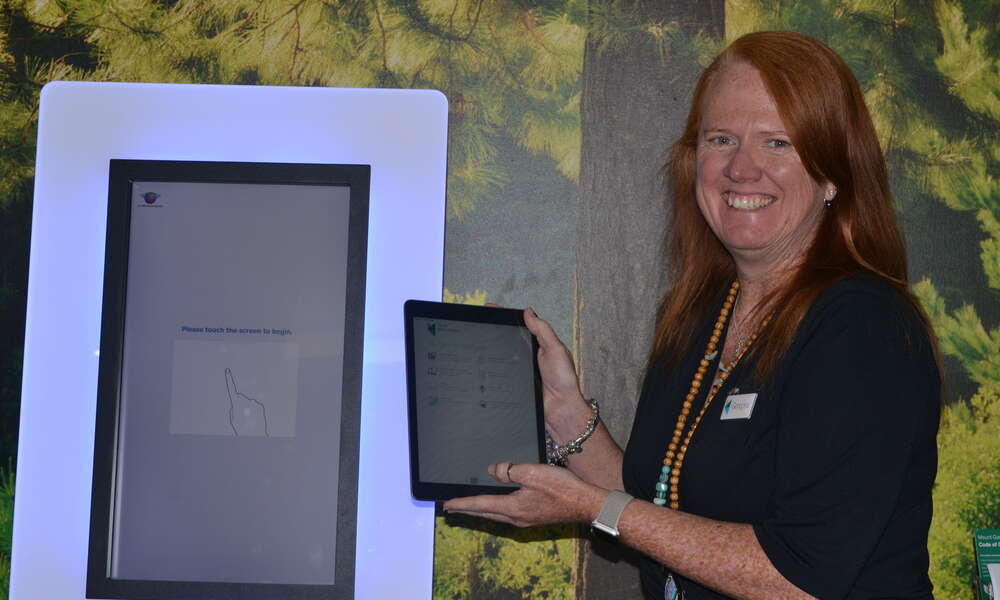Library Manager Georgina Davison with the new Libraries SA app.
