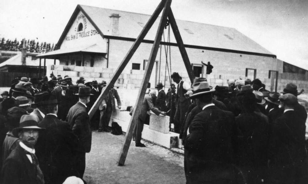 A digitised original photograph of the foundation stone being lowered into place by Mayor Spehr in 1924. - Les Hill Historical Collection, Mount Gambier Library.