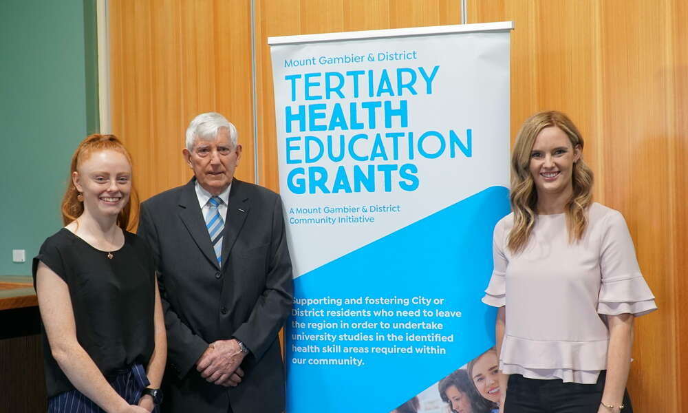 Previous grant recipients Cody Lewis (left) and Amelia Hancock with THEG chairman Ken Stafford (centre).