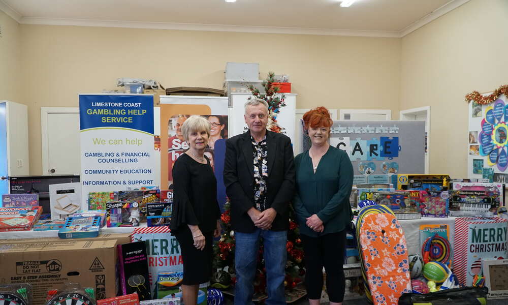 Mayor Lynette Martin and Lifeline CEO Leah Griffin (right) were blown away with the donation of toys to Lifeline’s Christmas Cheer program from recent graduate of the Limestone Coast Regional Gambling Help Service Paul Sundstrom (centre).
