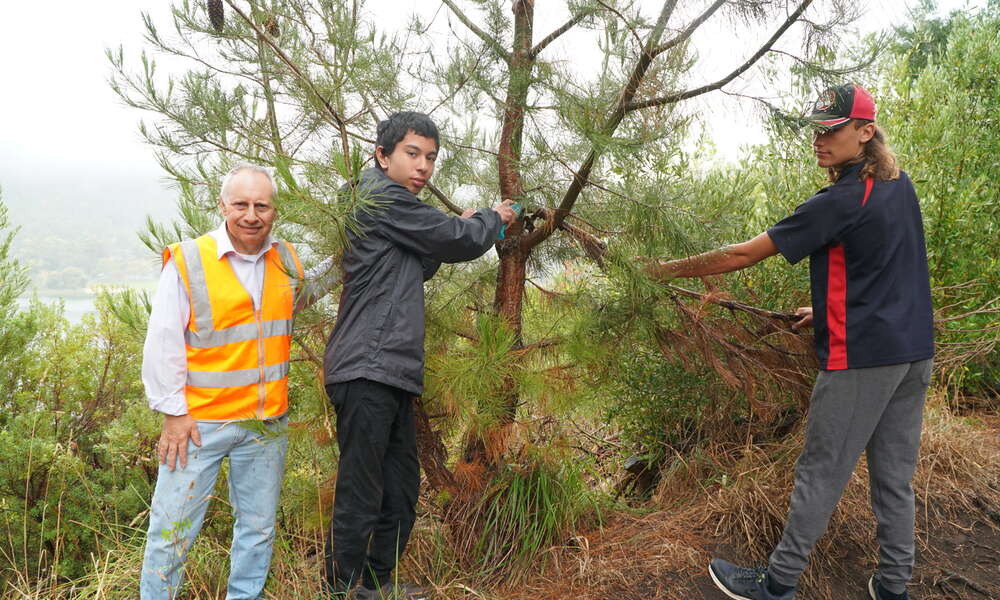 City of Mount Gambier Valley Lakes Conservation Park Coordinator Orazio Cultreri with Millicent High School Conservation and Land Management students Jason and James.