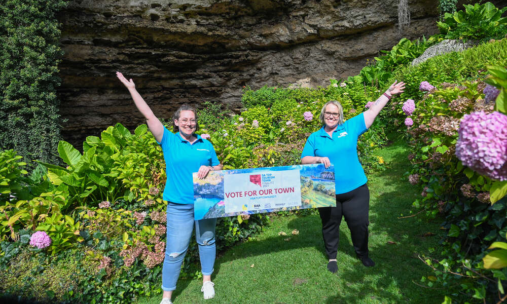 Mount Gambier Visitor Centre Service Ambassadors Sarah Norris and Tracey Martin celebrate Mount Gambier’s nomination as a finalist for the SA Top Tourism Town Award.