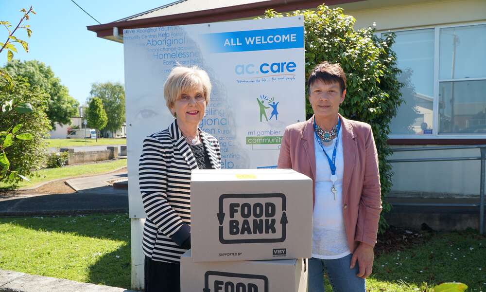 Mayor Lynette Martin and ac.care Manager Homelessness Services Trish Spark with Christmas hampers provided to families during the festive season.