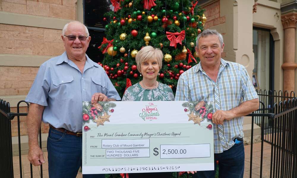 Rotary Club of Mount Gambier President Pat McEwen and Treasurer John Buchanan present Mayor Lynette Martin with a cheque to the value of $2,500 to support the Mount Gambier Community Mayor’s Christmas Appeal.